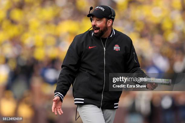 Head coach Ryan Day of the Ohio State Buckeyes argues a review of a touchdown against the Michigan Wolverines during the second quarter in the game...