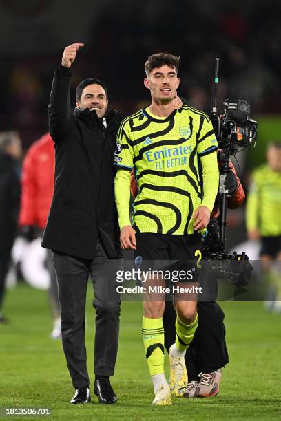 Mikel Arteta, Manager of Arsenal, celebrates with Kai Havertz following the team's victory during the Premier League match between Brentford FC and...