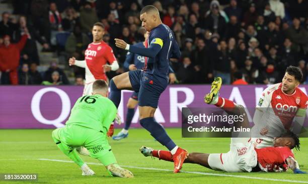 Kylian Mabppe of Paris Saint-Germain in action over Philipp Kohn, Wilfried Singo and Guillermo Maripan of Monaco during the Ligue 1 Uber Eats match...