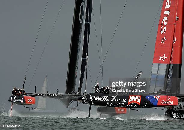 Emirates Team New Zealand skippered by Dean Barker races against Oracle Team USA skippered by James Spithill at the start of race 13 of the America's...