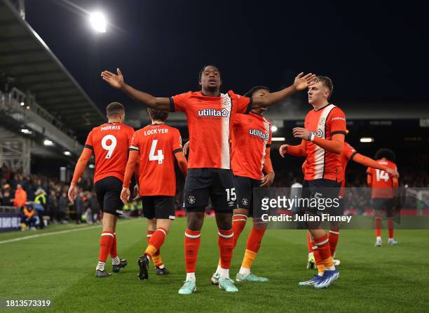Teden Mengi of Luton Town celebrates with teammate Alfie Doughty after scoring the team's first goal during the Premier League match between Luton...