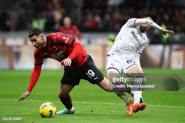 Theo Hernandez of AC Milan clashes with Fabiano Parisi of ACF Fiorentina during the Serie A TIM match between AC Milan and ACF Fiorentina at Stadio...