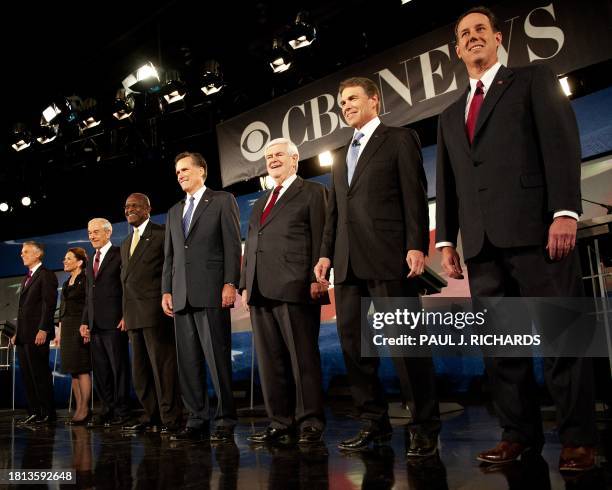 Republician Presidential hopefuls, from L to R, Jon Huntsman, Michele Bachmann, Ron Paul, Herman Cain, Mitt Romney, Newt Gingrich, Rick Perry and...