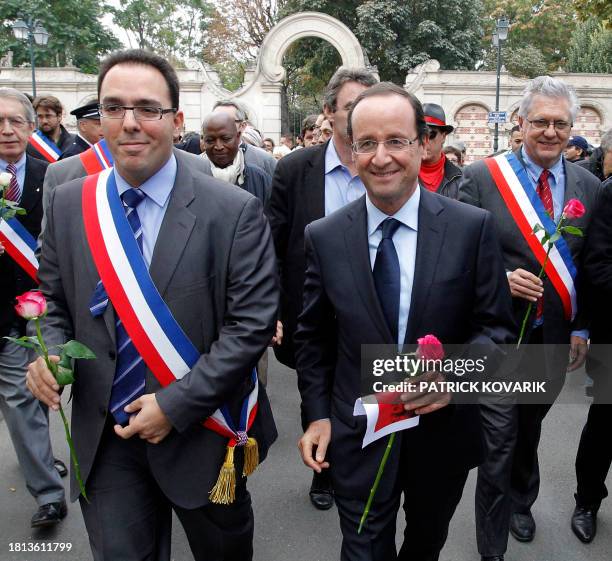 Winner of the Socialist Party 2011 primary vote for 2012 French presidential election, Francois Hollande , flanked by Clichy's mayor Gilles Catoire...