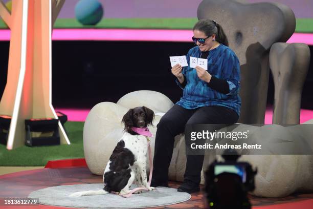 Michaela Frank and her dog Amie perform on stage during the "Wetten, Dass ...?" tv show on November 25, 2023 in Offenburg, Germany.