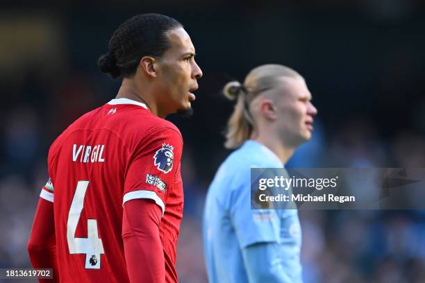 Virgil van Dijk of Liverpool looks on with Erling Haaland of Manchester City during the Premier League match between Manchester City and Liverpool FC...