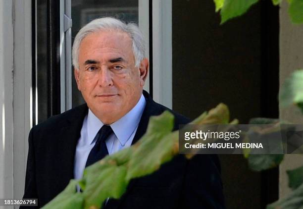 Former French IMF chief Dominique Strauss-Kahn leaves the financial crimes unit of the French police on September 29, 2011 in Paris, at the end of a...