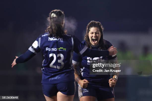 Katana Howard and Rachael Woosey of Sale Sharks celebrate victory at the finale whistle during the Allianz Premiership Women's Rugby match between...