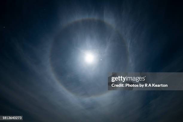 a moon halo in a cold winter sky - halo stock pictures, royalty-free photos & images