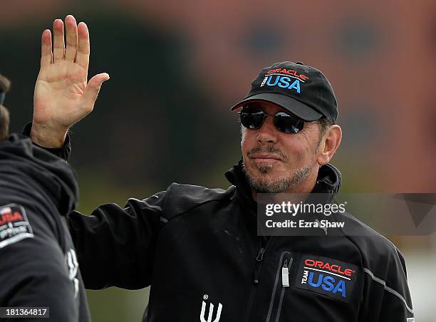 Oracle CEO Larry Ellison celebrates after Oracle Team USA skippered by James Spithill beat Emirates Team New Zealand skippered by Dean Barker in race...