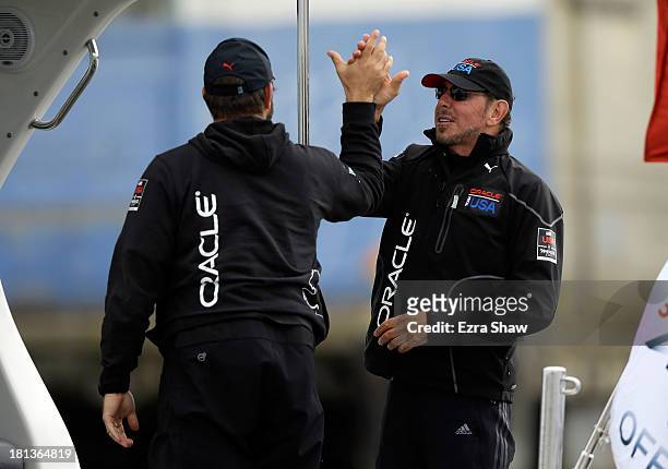 Oracle CEO Larry Ellison celebrates after Oracle Team USA skippered by James Spithill beat Emirates Team New Zealand skippered by Dean Barker in race...