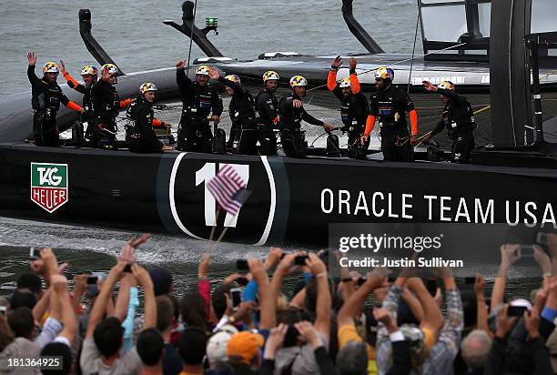 Oracle Team USA skippered by James Spithill celebrates after defeating Emirates Team New Zealand skippered by Dean Barker during race 13 of the...