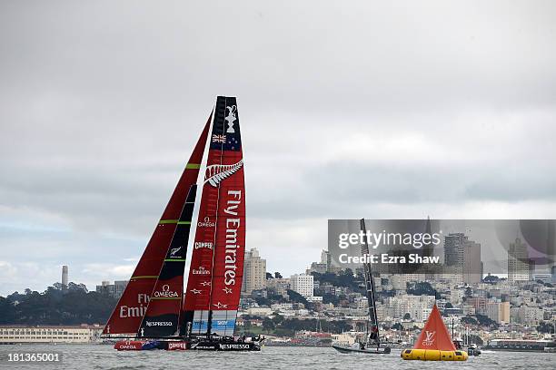 Emirates Team New Zealand skippered by Dean Barker races against Oracle Team USA skippered by James Spithill at the start of race 13 of the America's...