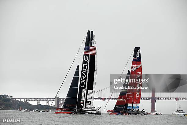 Oracle Team USA skippered by James Spithill races against Emirates Team New Zealand skippered by Dean Barker during race 13 of the America's Cup...