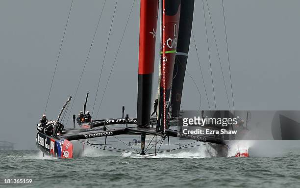 Emirates Team New Zealand skippered by Dean Barker in action against Oracle Team USA skippered by James Spithill during race 13 of the America's Cup...