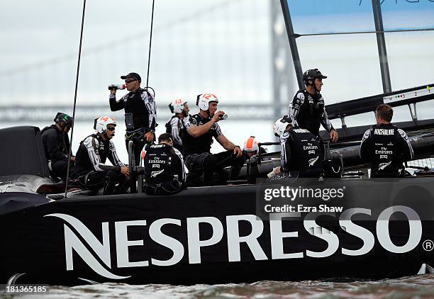 Emirates Team New Zealand skippered by Dean Barker sits on their boat after race 13 was abandoned due to the fact they exceeded the time limit of...