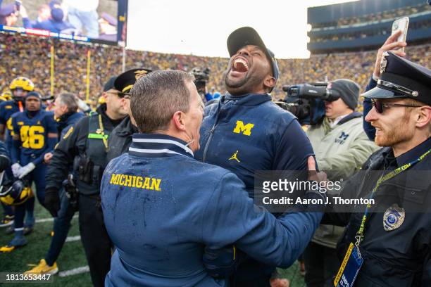 Head Football Coach Sherrone Moore of the Michigan Wolverines reacts after his team beat the Ohio State Buckeyes in a college football game at...