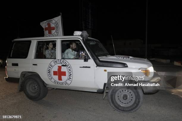 Hostages are transported in International Committee of the Red Cross vehicles from the Gaza Strip through the Rafah land crossing on November 25,...