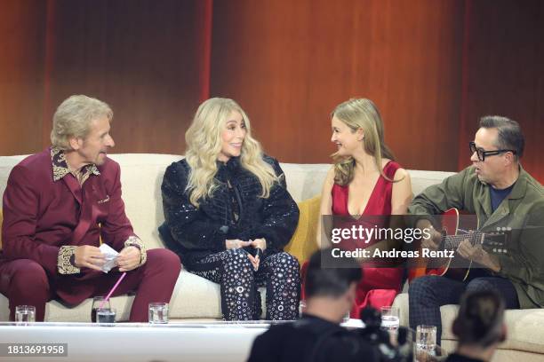 Thomas Gottschalk, Cher, Stefanie Stappenbeck and Jan Josef Liefers speak on stage during the "Wetten, Dass ...?" tv show on November 25, 2023 in...