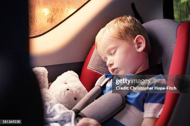 sleeping in the back seat - car interior stock pictures, royalty-free photos & images