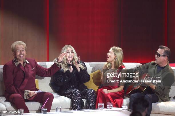 Thomas Gottschalk, Cher, Stefanie Stappenbeck and Jan Josef Liefers speak on stage during the "Wetten, Dass ...?" tv show on November 25, 2023 in...