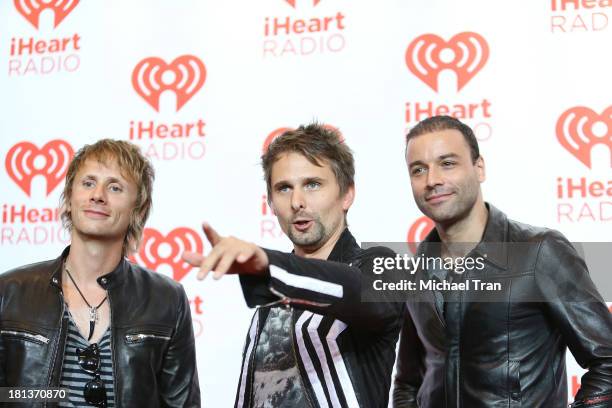 Dominic Howard, Matt Bellamy and Christopher Wolstenholme of Muse arrive at the iHeartRadio Music Festival - press room held at MGM Grand Arena on...