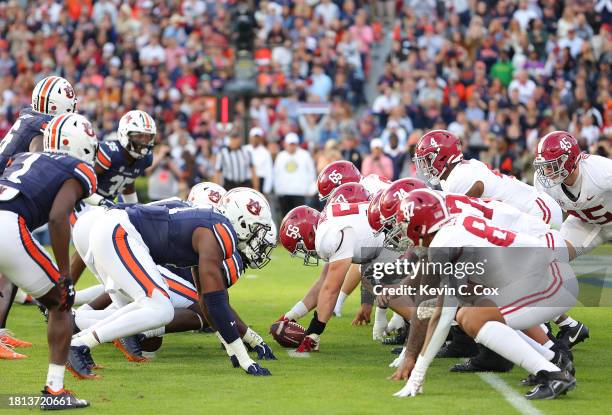 Jalen Milroe of the Alabama Crimson Tide lines the offense up against the Auburn Tigers during the second quarter at Jordan-Hare Stadium on November...