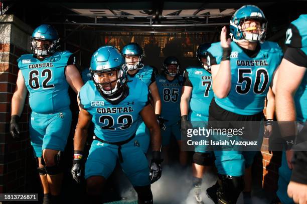 Jacob Proche of the Coastal Carolina Chanticleers enters the field to take on the James Madison Dukes at Brooks Stadium on November 25, 2023 in...