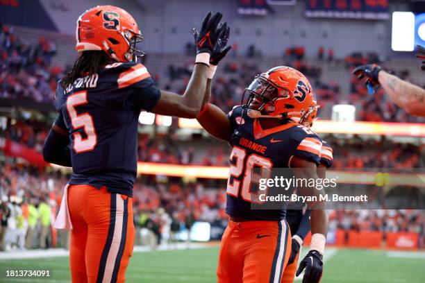 Damien Alford, left, and Juwaun Price of the Syracuse Orange celebrate after Alford scored a touchdown during the third quarter against the Wake...