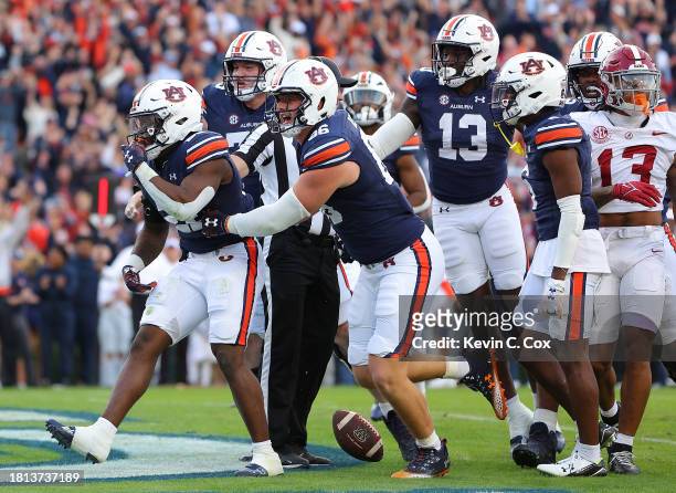Damari Alston of the Auburn Tigers reacts after rushing for a touchdown against Jaylen Key of the Alabama Crimson Tide during the first quarter at...