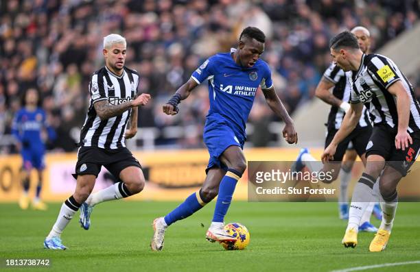 Chelsea player Nicolas Jackson runs at the Newcastle defence during the Premier League match between Newcastle United and Chelsea FC at St. James...