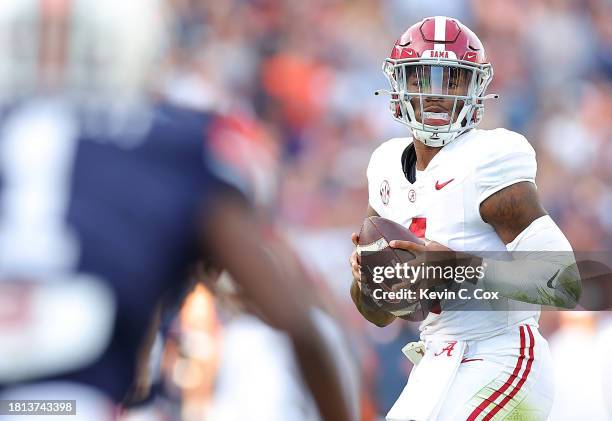 Jalen Milroe of the Alabama Crimson Tide looks to pass against the Auburn Tigers during the second quarter at Jordan-Hare Stadium on November 25,...