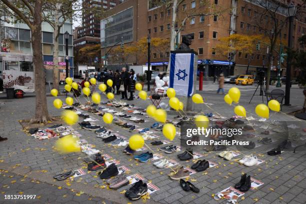 Pro-Israel supporters stage a pop-up exhibit honoring the hostages held by Hamas during an action demanding the return of all those still being held...