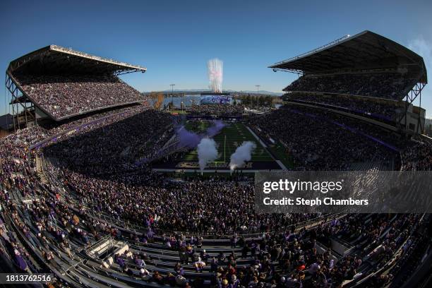 The Washington Huskies take the field before the game against the Washington State Cougars in the 115th Apple Cup at Husky Stadium on November 25,...