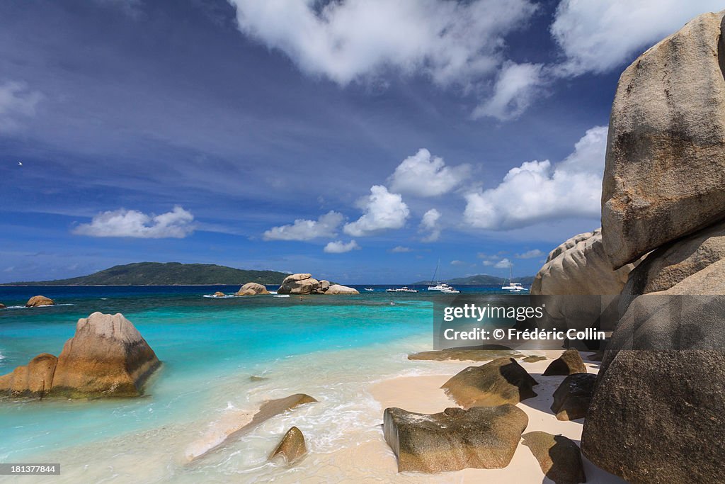 Cocos island beach and boulders in Seychelles