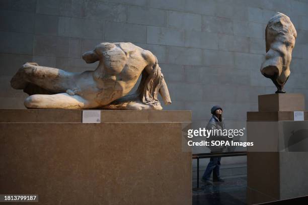 Visitor views Elgin marbles also known as the Parthenon marbles, at the British Museum, London following a diplomatic row between UK and Greece....