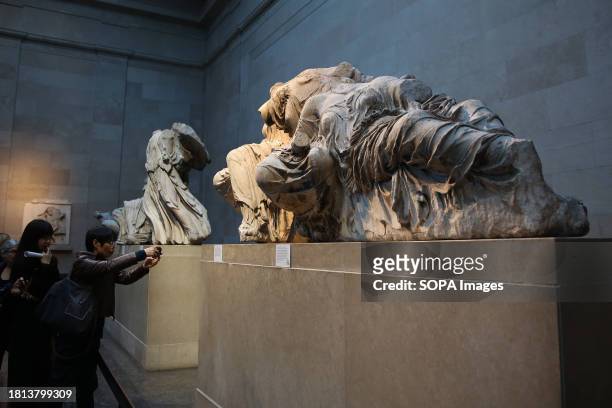Visitors view Elgin marbles also known as the Parthenon marbles, at the British Museum, London following a diplomatic row between UK and Greece....