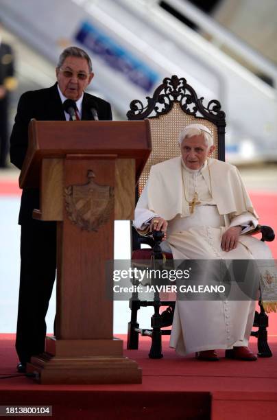 Pope Benedict XVI listens to Cuban President Raul Castro delivering a speech during a ceremony following his arrival at Antonio Macedo airport, in...