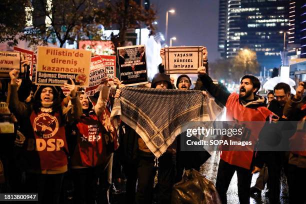 Protester holds the Palestinian keffiyeh in solidarity with the Palestinians during the demonstration. The Turkish Workers' Party organized a protest...