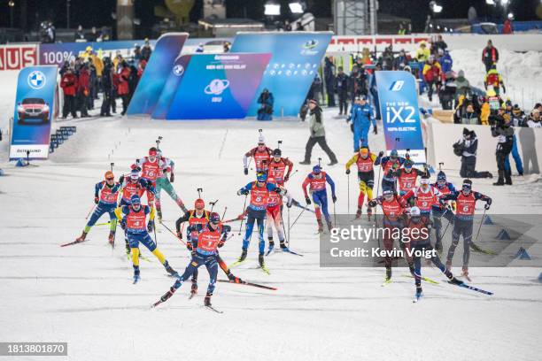 Endre Stroemsheim of Norway, David Zobel of Germany and Eric Perrot of France in action competes during the Men 4x7.5 km Relay at the BMW IBU World...