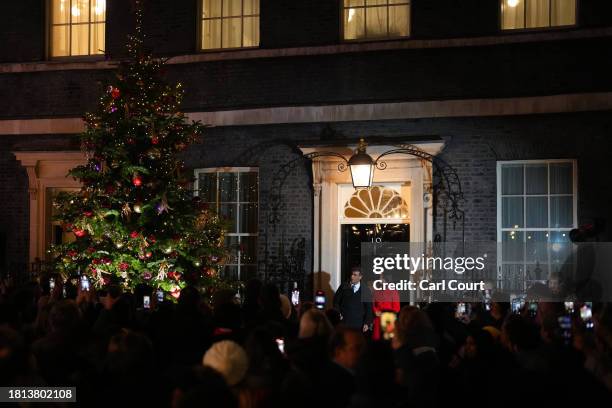 Britain's Prime Minister, Rishi Sunak, and his wife Akshata Murty switch on the Christmas tree lights in Downing Street on November 30, 2023 in...
