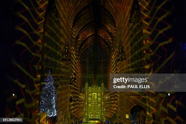 Light and sound show created by Luxmuralis, "The Light Before Christmas: The Manger" is displayed in Liverpool Cathedral on November 30, 2023 in...