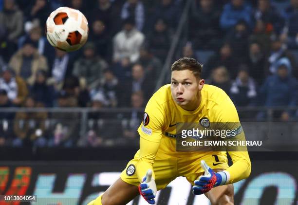 Sturm Graz's Dutch goalkeeper Kjell Scherpen saves the ball during the UEFA Europa League Group D football match between Sturm Graz and Rakow...