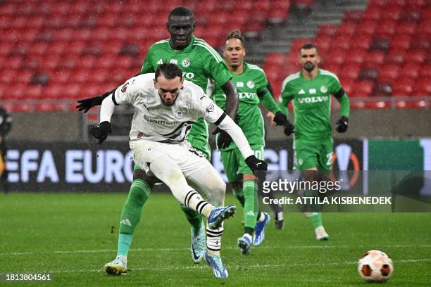 Rennes' Algerian forward Amine Gouiri kicks the ball to score the 2-0 goal during the UEFA Europa League Group F football match between Maccabi Haifa...