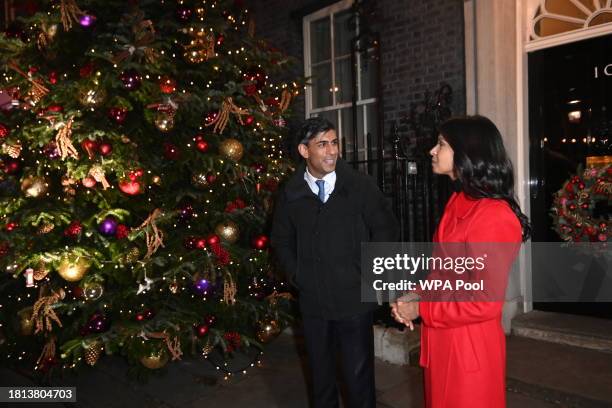 British Prime Minister Rishi Sunak and wife Akshata Murty stand outside 10 Downing Street as they attend the Downing Street Christmas Fair and lights...