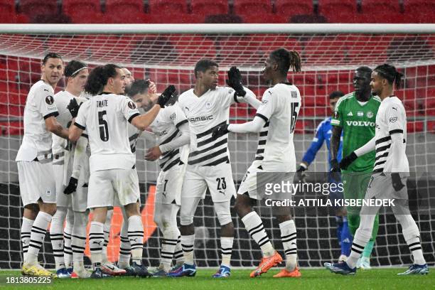 Rennes' players celebrate after Rennes' French forward Martin Terrier scored the opening goal during the UEFA Europa League Group F football match...