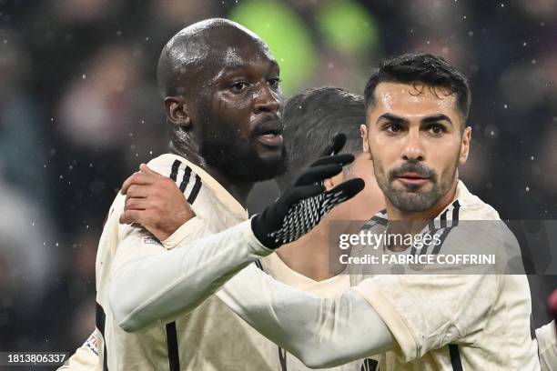 Roma's Belgian midfielder Romelu Lukaku celebrates with Roma's Turkish defender Mehmet Zeki Celik after scoring his team's first goal during the UEFA...