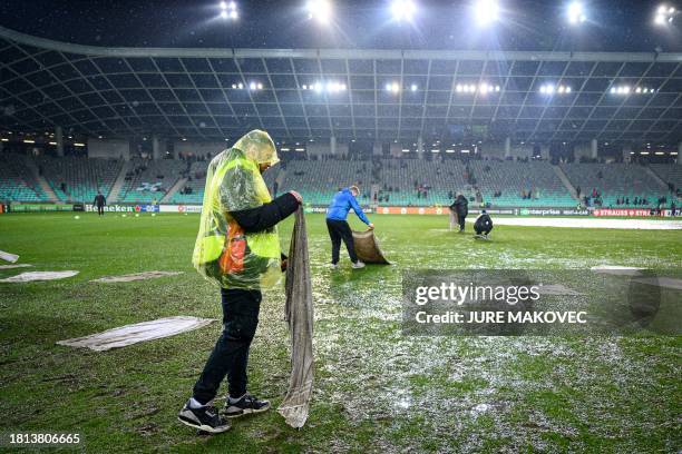 Stadium staff prepare the pitch ahead of the UEFA Europa Conference League Group A football match between NK Olimpija Ljubljana and LOSC Lille at the...