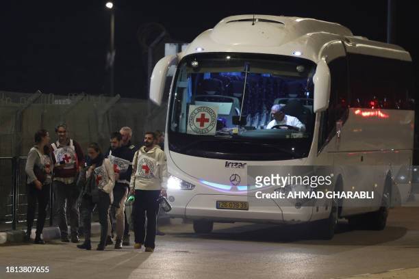 Red Cross bus and delegation arrive outside the Israeli Ofer military prison located between Ramallah and Beitunia in the occupied West Bank on...