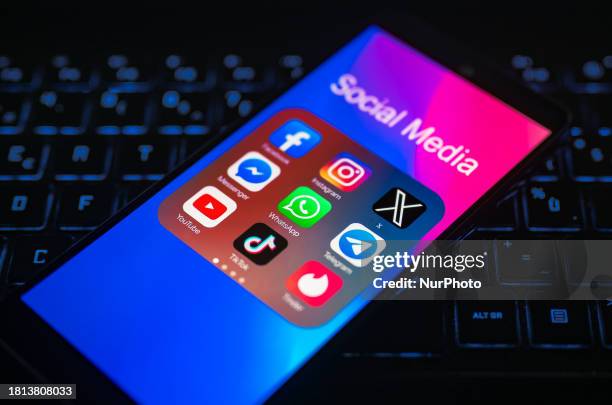 Close-up of the X mobile app is being displayed on a smartphone screen alongside Facebook, TikTok, Telegram, Instagram, X, YouTube, and Messenger in...